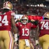 FootballR - NFL - Die Football-Spieler der San Francisco 49ers feiern, während sie Jerry Jones und die Cowboys demütigen. Brock Purdy